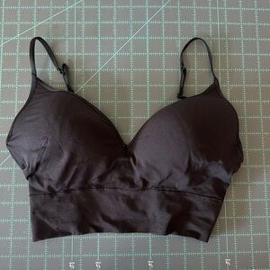 Jockey bra. Never worn. Tshirt style. Longer for coverage of torso.